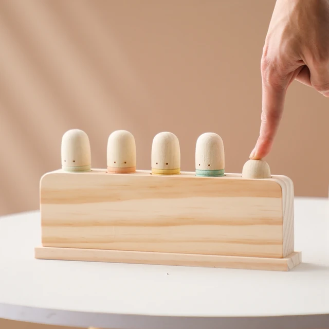 Press and bounce wooden worms