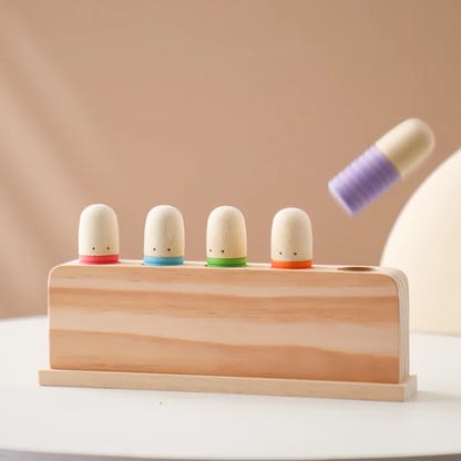 Press and bounce wooden worms